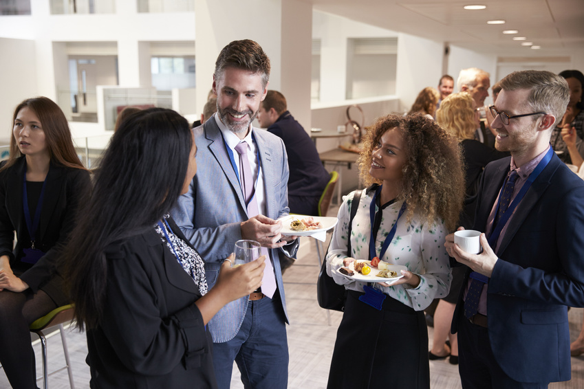 Delegates Networking During Conference Lunch Break